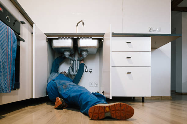 Professional Emergency Plumber technician working in Midway, KY